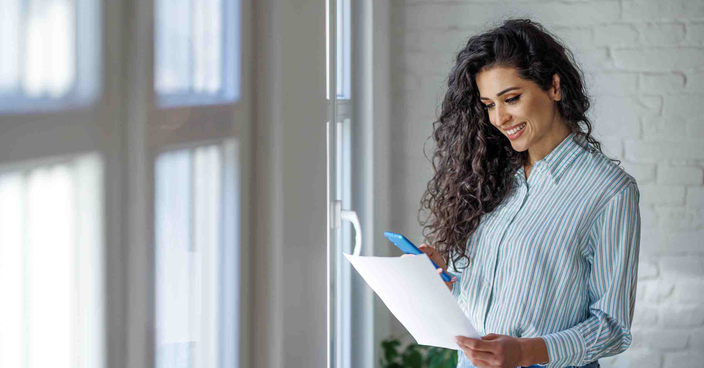 Woman smiling and reading